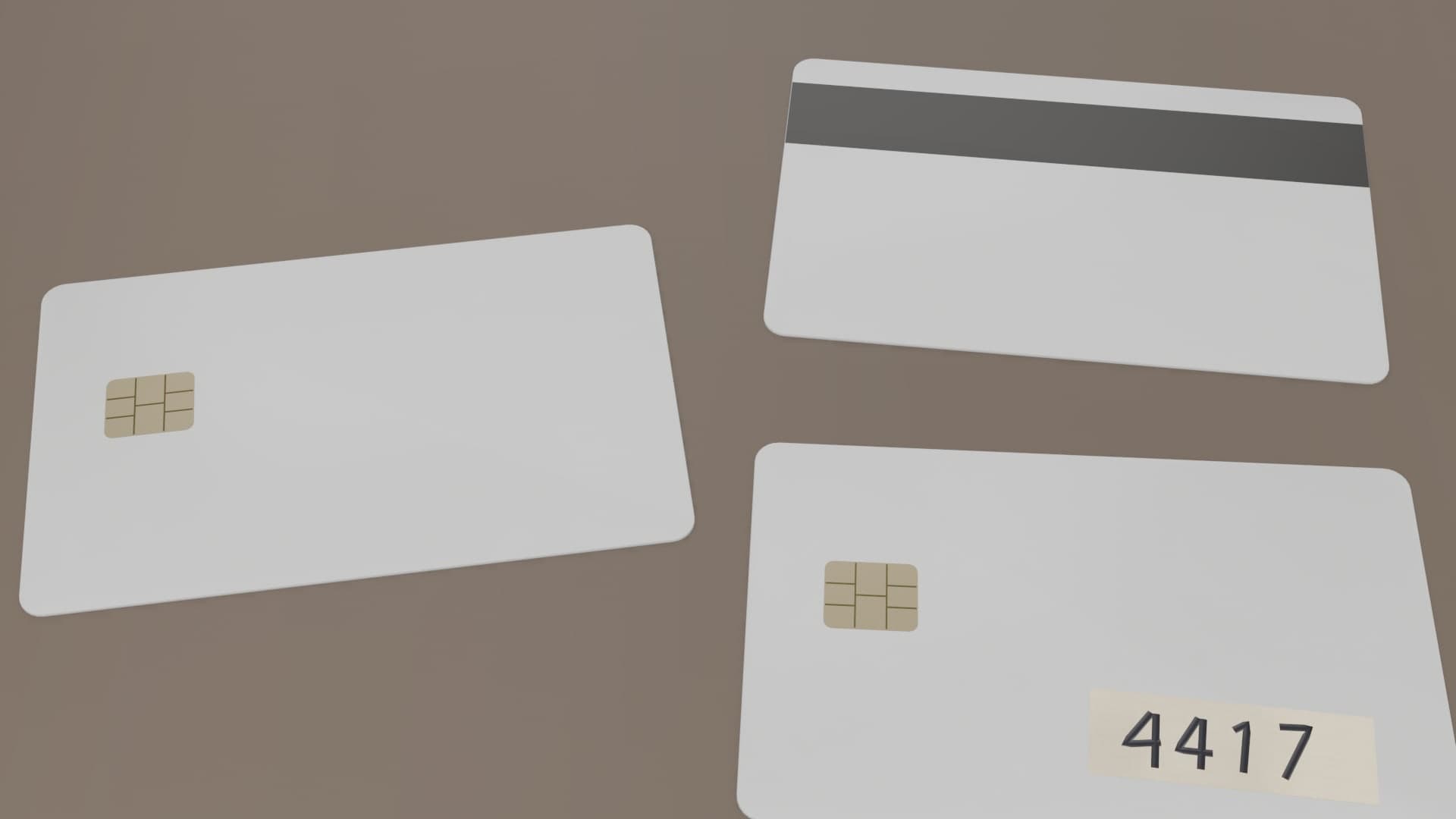 Two blank cards and a cloned card with a strip of tape marked 4417