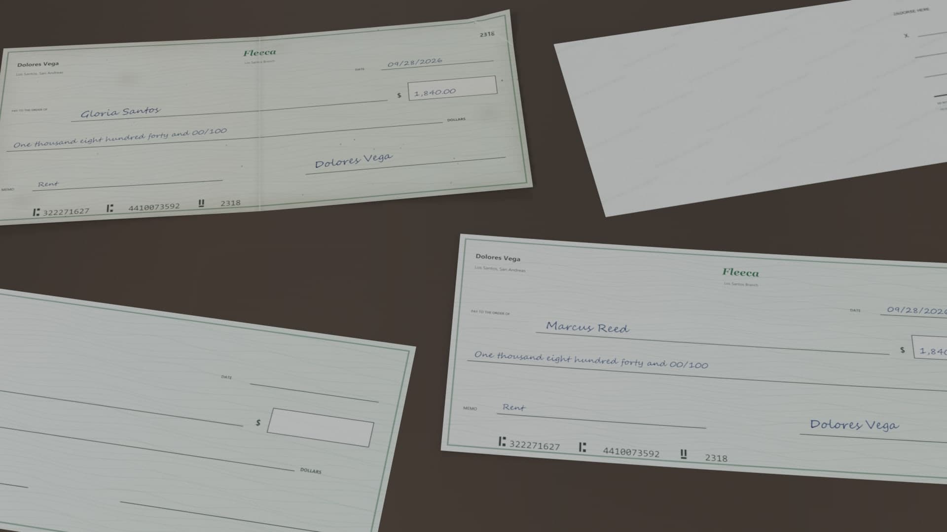 A stolen check, a blank check and a forged check lying on a table