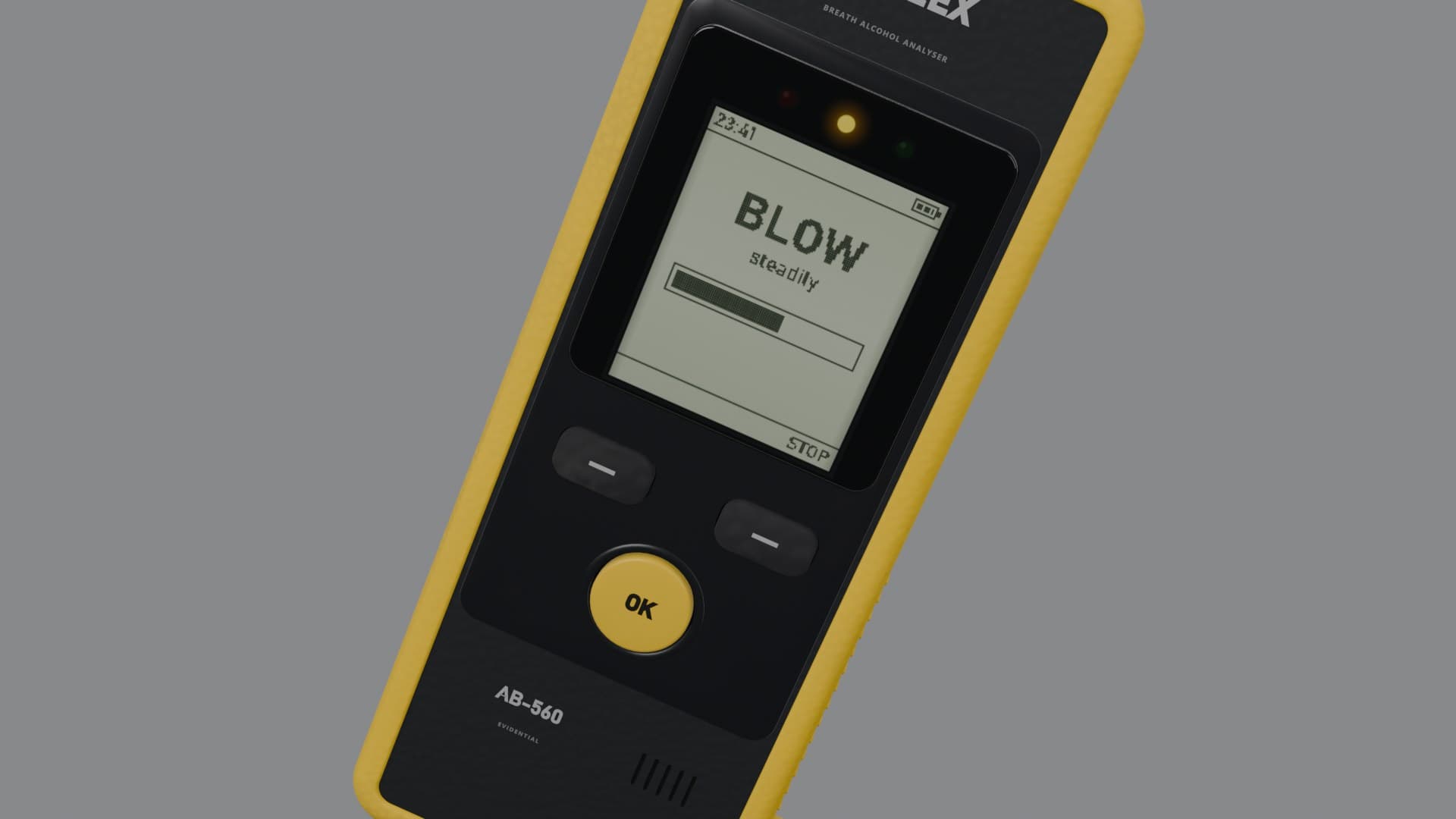 The breathalyzer’s screen saying BLOW steadily, with a breath bar half full and the amber light on